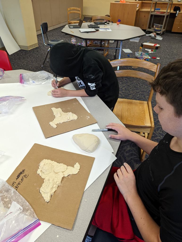 4th graders making maps with dough.