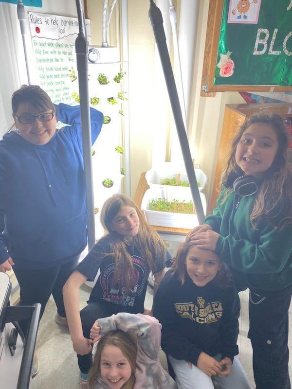 4th graders growing plants using a Growth Tower