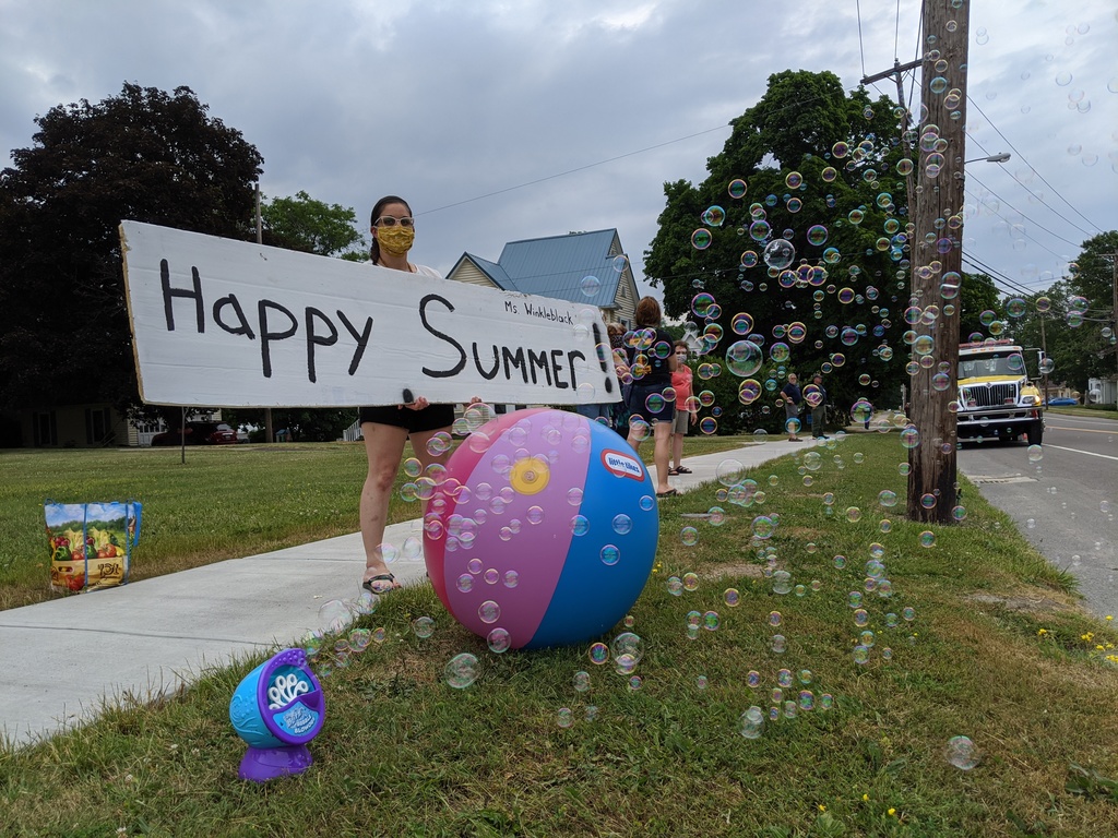 Teacher Holding Happy Summer Sign